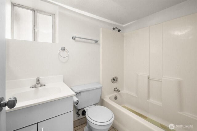 6638 Corson Ave S, Seattle, WA 98108 - bathroom featuring toilet, shower / bath combination, and vanity