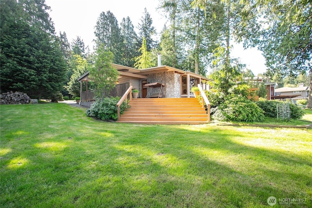 3003 Haxton Way, Bellingham, WA 98226 - back of property with stone siding, stairs, a wooden deck, and a lawn