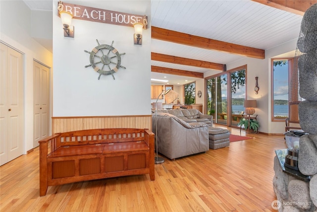 3003 Haxton Way, Bellingham, WA 98226 - living room with wood finished floors, beamed ceiling, and a wainscoted wall