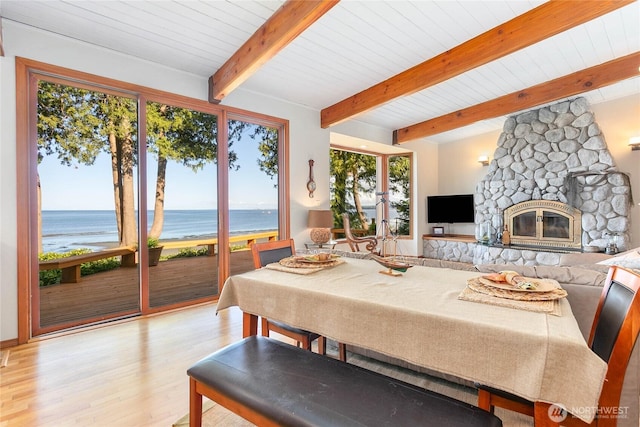 3003 Haxton Way, Bellingham, WA 98226 - dining space with light wood finished floors, wooden ceiling, and a stone fireplace