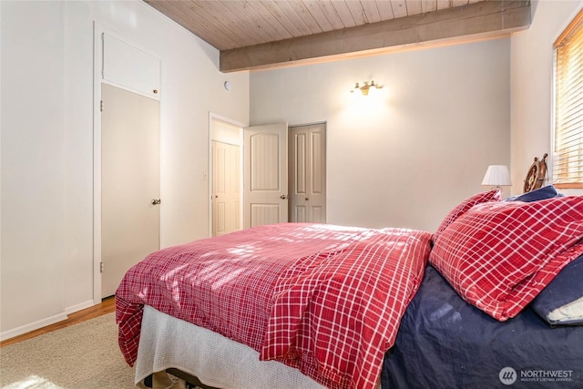3003 Haxton Way, Bellingham, WA 98226 - bedroom with wood finished floors, beam ceiling, a closet, wood ceiling, and baseboards