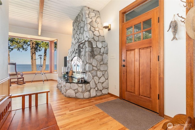 3003 Haxton Way, Bellingham, WA 98226 - foyer entrance with wood finished floors, baseboards, a water view, and a fireplace
