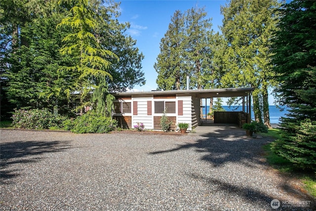 3003 Haxton Way, Bellingham, WA 98226 - view of front facade with gravel driveway and an attached carport