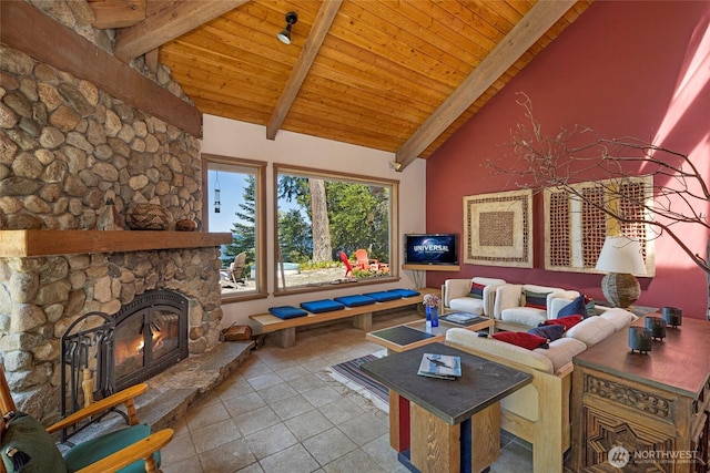 30 Smugglers Rowe, Henry Island, WA 98250 - tiled living area featuring wood ceiling, beam ceiling, high vaulted ceiling, and a stone fireplace