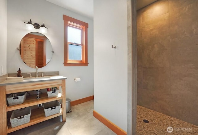 full bathroom with vanity, baseboards, walk in shower, and toilet
