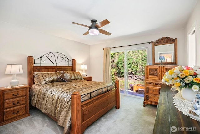bedroom featuring light colored carpet, access to exterior, and ceiling fan