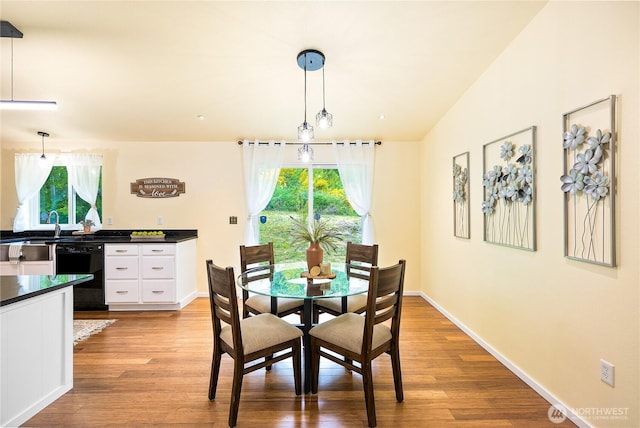 18514 71st St NW, Vaughn, WA 98394 - dining area featuring plenty of natural light, light wood-style flooring, and baseboards