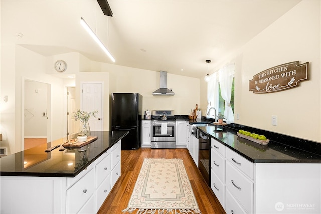 18514 71st St NW, Vaughn, WA 98394 - kitchen featuring black appliances, wall chimney exhaust hood, a sink, dark wood finished floors, and white cabinets