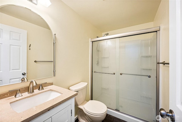18514 71st St NW, Vaughn, WA 98394 - bathroom with a shower stall, toilet, and vanity