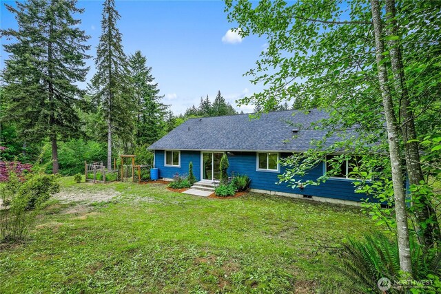 18514 71st St NW, Vaughn, WA 98394 - back of house featuring a lawn and a shingled roof