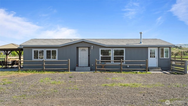 manufactured / mobile home featuring a gazebo and fence