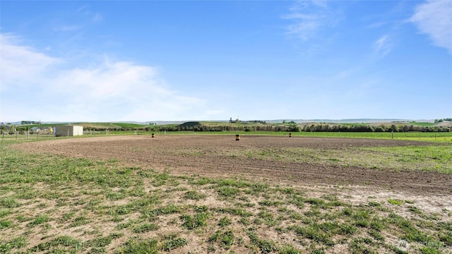 view of yard with a rural view