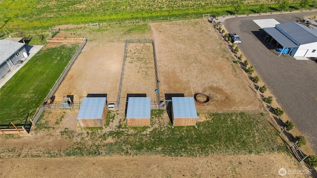 birds eye view of property featuring a rural view