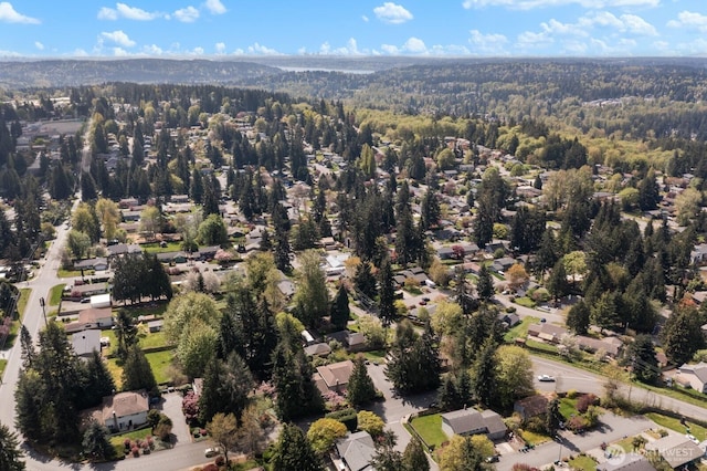 aerial view with a residential view and a wooded view