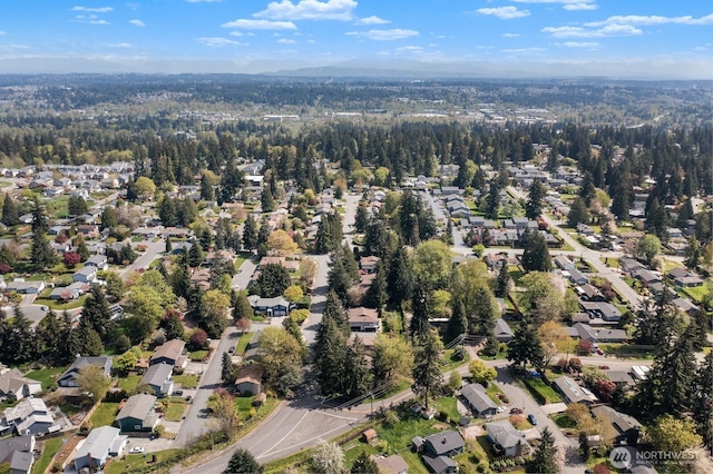 bird's eye view featuring a residential view and a view of trees