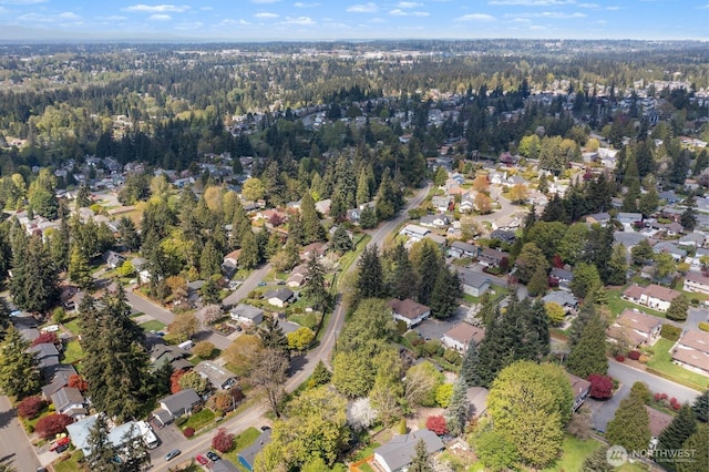 aerial view featuring a residential view and a forest view