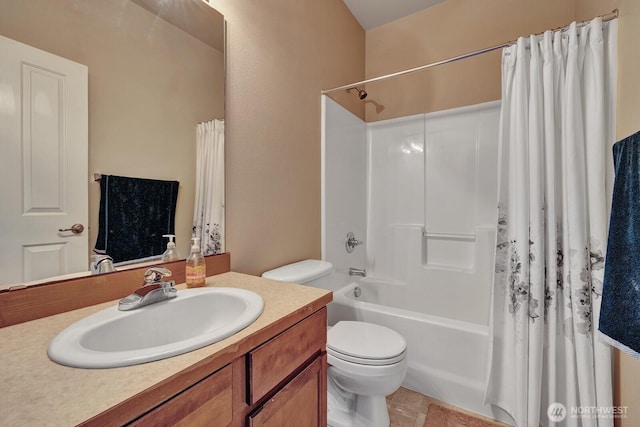 full bathroom with vanity, shower / bath combo, and toilet