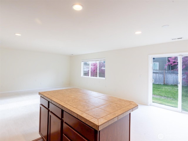 kitchen with light carpet, recessed lighting, and visible vents