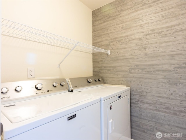 laundry room with separate washer and dryer and laundry area