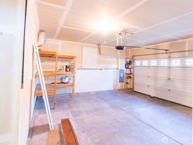 garage featuring a garage door opener and electric panel