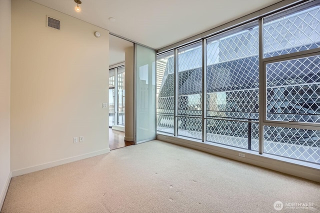 909 5th Ave Unit 701, Seattle, WA 98104 - carpeted empty room featuring baseboards and visible vents
