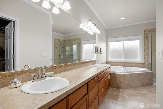 bathroom with a sink, double vanity, tile patterned floors, a shower stall, and a bath