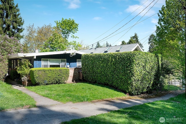 812 N 59th St, Seattle, WA 98103 - view of front of home with a front lawn and board and batten siding
