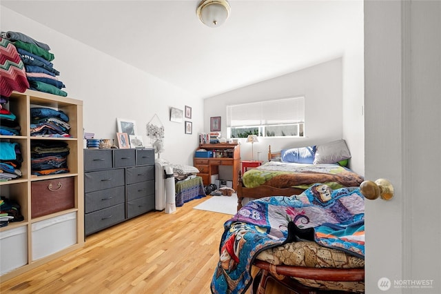 812 N 59th St, Seattle, WA 98103 - bedroom with lofted ceiling and wood finished floors