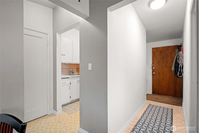812 N 59th St, Seattle, WA 98103 - hall featuring a sink, light floors, and baseboards