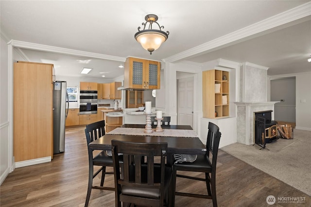 7295 Navajo Trl NE, Bremerton, WA 98311 - dining room with crown molding, light wood-style floors, baseboards, and a high end fireplace