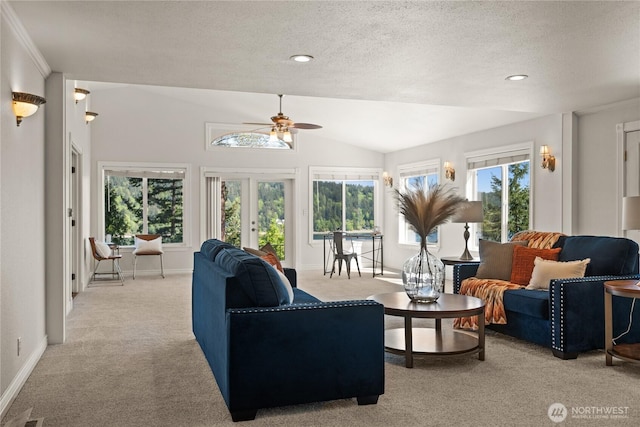 7295 Navajo Trl NE, Bremerton, WA 98311 - living area with light carpet, ceiling fan, a textured ceiling, plenty of natural light, and lofted ceiling