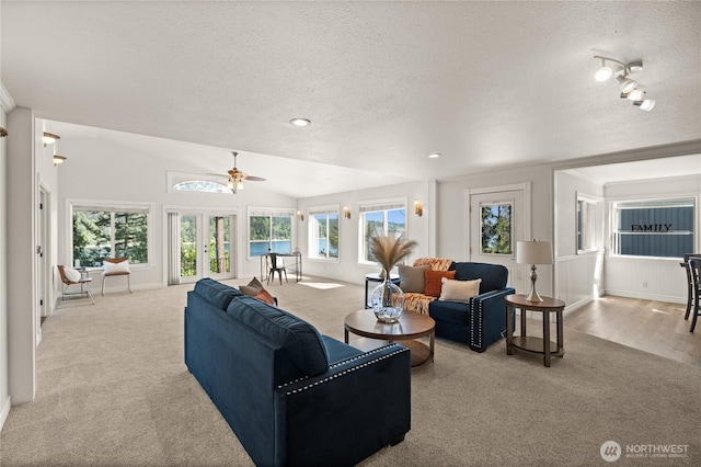 7295 Navajo Trl NE, Bremerton, WA 98311 - carpeted living area featuring a textured ceiling, ceiling fan, vaulted ceiling, recessed lighting, and baseboards