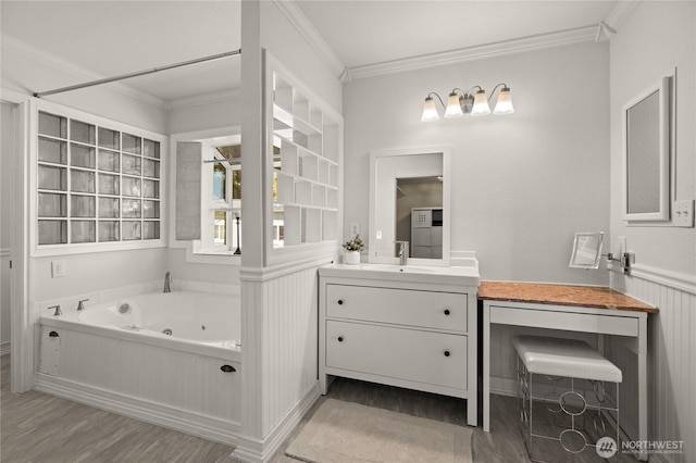 7295 Navajo Trl NE, Bremerton, WA 98311 - full bathroom featuring crown molding, wood finished floors, vanity, and a whirlpool tub
