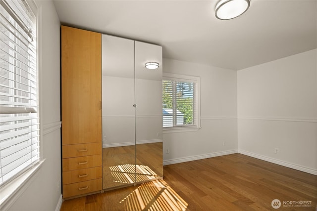 7295 Navajo Trl NE, Bremerton, WA 98311 - unfurnished bedroom with wood finished floors and baseboards