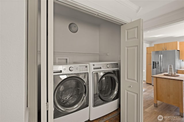 7295 Navajo Trl NE, Bremerton, WA 98311 - washroom with independent washer and dryer, wood finished floors, and ornamental molding