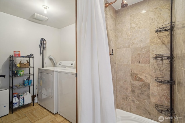 washroom featuring washer and clothes dryer
