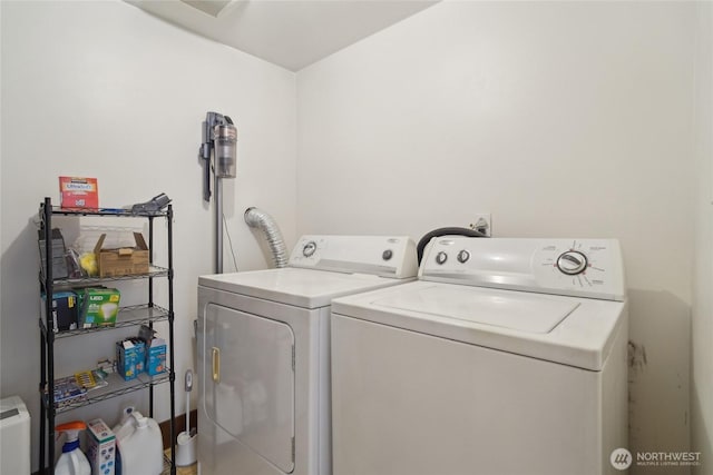 washroom featuring washer and clothes dryer