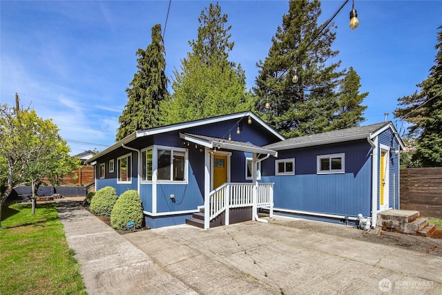8411 48th Ave S, Seattle, WA 98118 - bungalow-style house featuring fence and a patio area