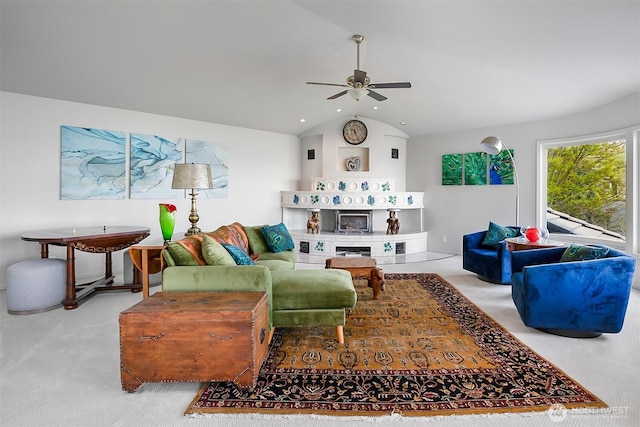 living room with carpet flooring, ceiling fan, and vaulted ceiling