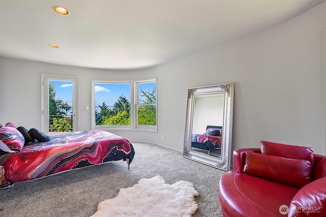 carpeted bedroom featuring access to outside, recessed lighting, and multiple windows