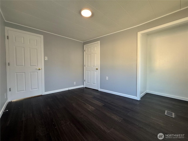 2021 Mahan Ave Unit E3, Richland, WA 99354 - spare room with baseboards, dark wood finished floors, and visible vents