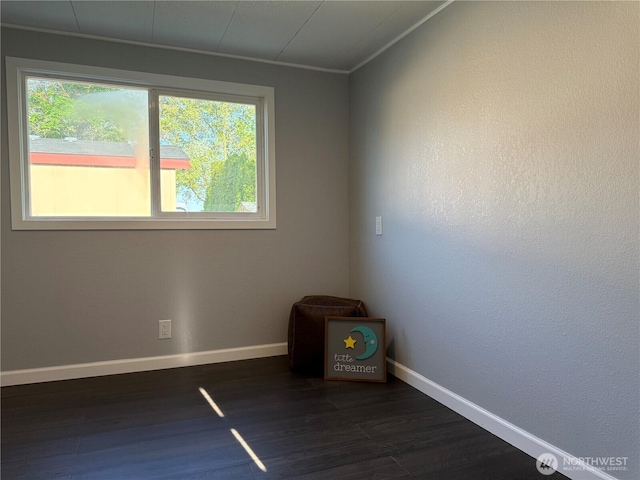 2021 Mahan Ave Unit E3, Richland, WA 99354 - unfurnished room with crown molding, baseboards, and dark wood-type flooring