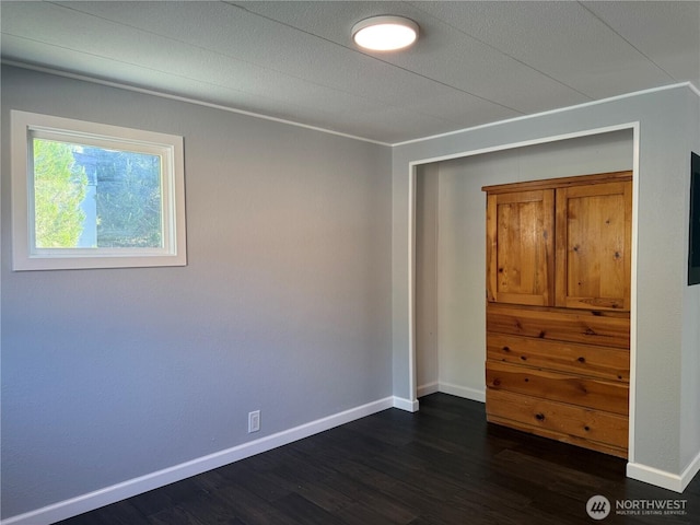 2021 Mahan Ave Unit E3, Richland, WA 99354 - spare room featuring baseboards and dark wood-style flooring