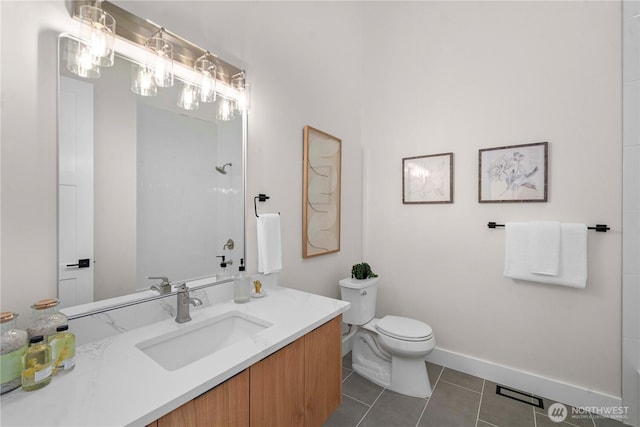 full bath with vanity, baseboards, tile patterned floors, and toilet
