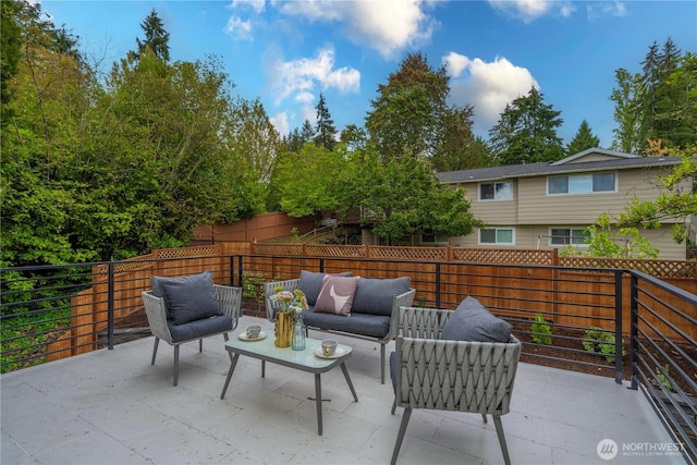 view of patio featuring an outdoor living space and a fenced backyard