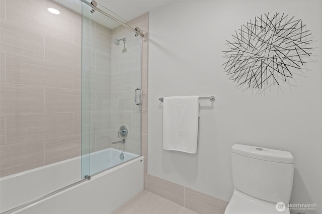 121 Stewart St Unit 2807, Seattle, WA 98101 - bathroom featuring combined bath / shower with glass door and toilet