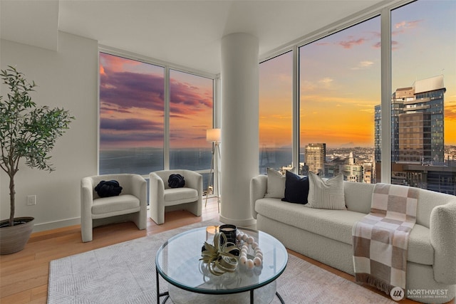 121 Stewart St Unit 2807, Seattle, WA 98101 - living area with wood finished floors and plenty of natural light