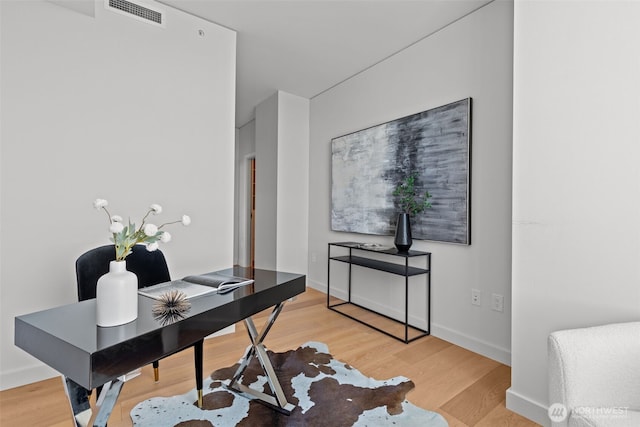 121 Stewart St Unit 2807, Seattle, WA 98101 - home office with light wood-style floors
