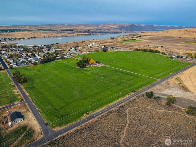 bird's eye view featuring a rural view and a water and mountain view