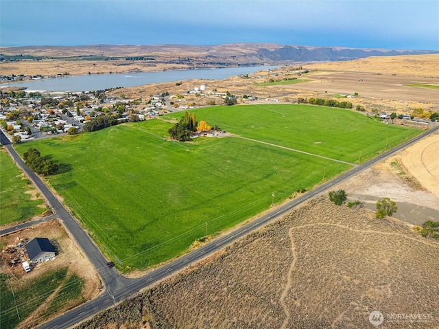 bird's eye view with a water view and a rural view